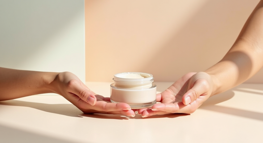 Two hands holding a single skincare product, highlighting its suitability for sensitive skin and the importance of mindful ingredient choices.